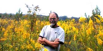 Jim standing among the goldenrods, image by Karen Wise of Kingston, Mississippi