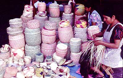 Francisca García Peralta, from San Luis Amatlán, Oaxaca, weaving in Oaxaca City's Mercado Juárez