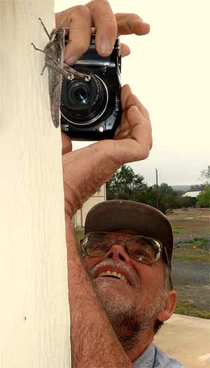 Jim Conrad taking a grasshopper picture