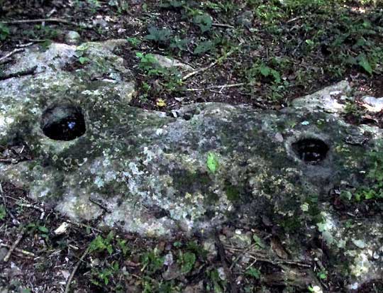 ancient Maya holes in stone?