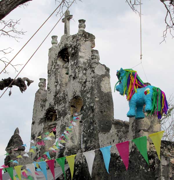 horse piñata hanging in tree
