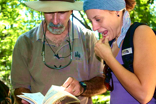 Using a field guide; image courtesy of Gary Peeples/USFWS