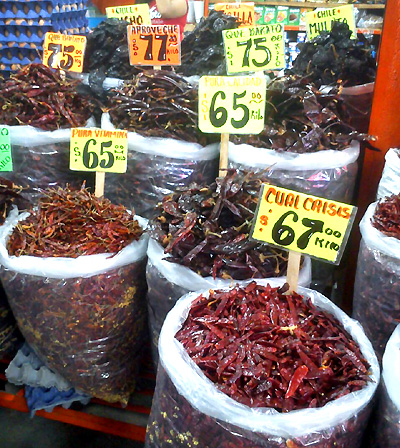 Dried peppers stacked on tables, image by Keith Baines of Jersey City, NJ